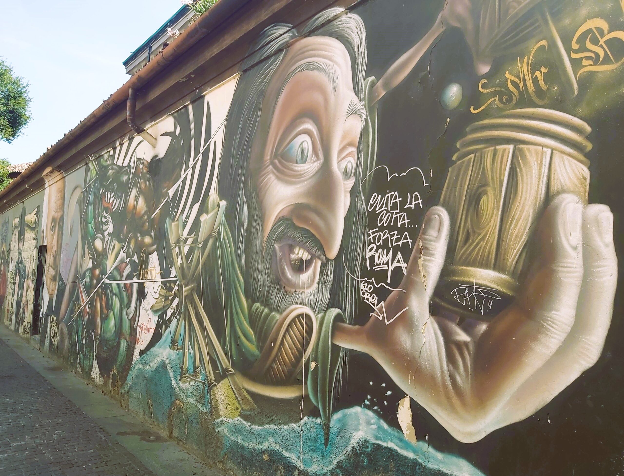 A graffiti image of a man holding a pot in Milan, Italy