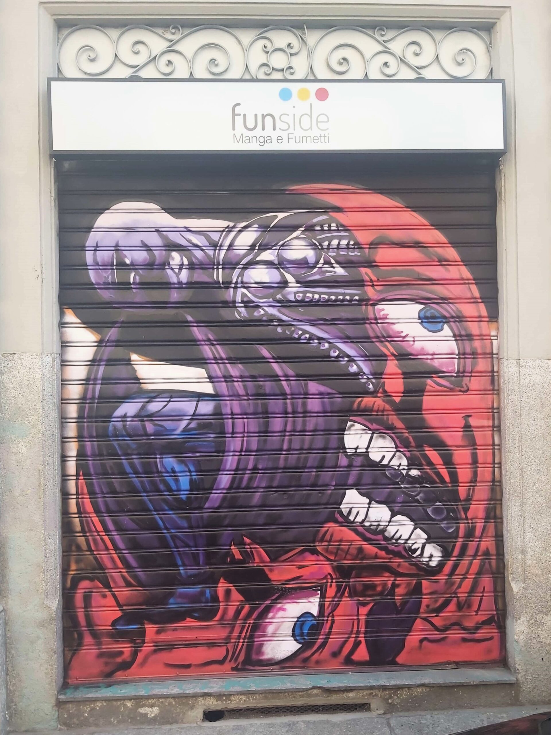 A graffiti image of a monster in Milan, Italy