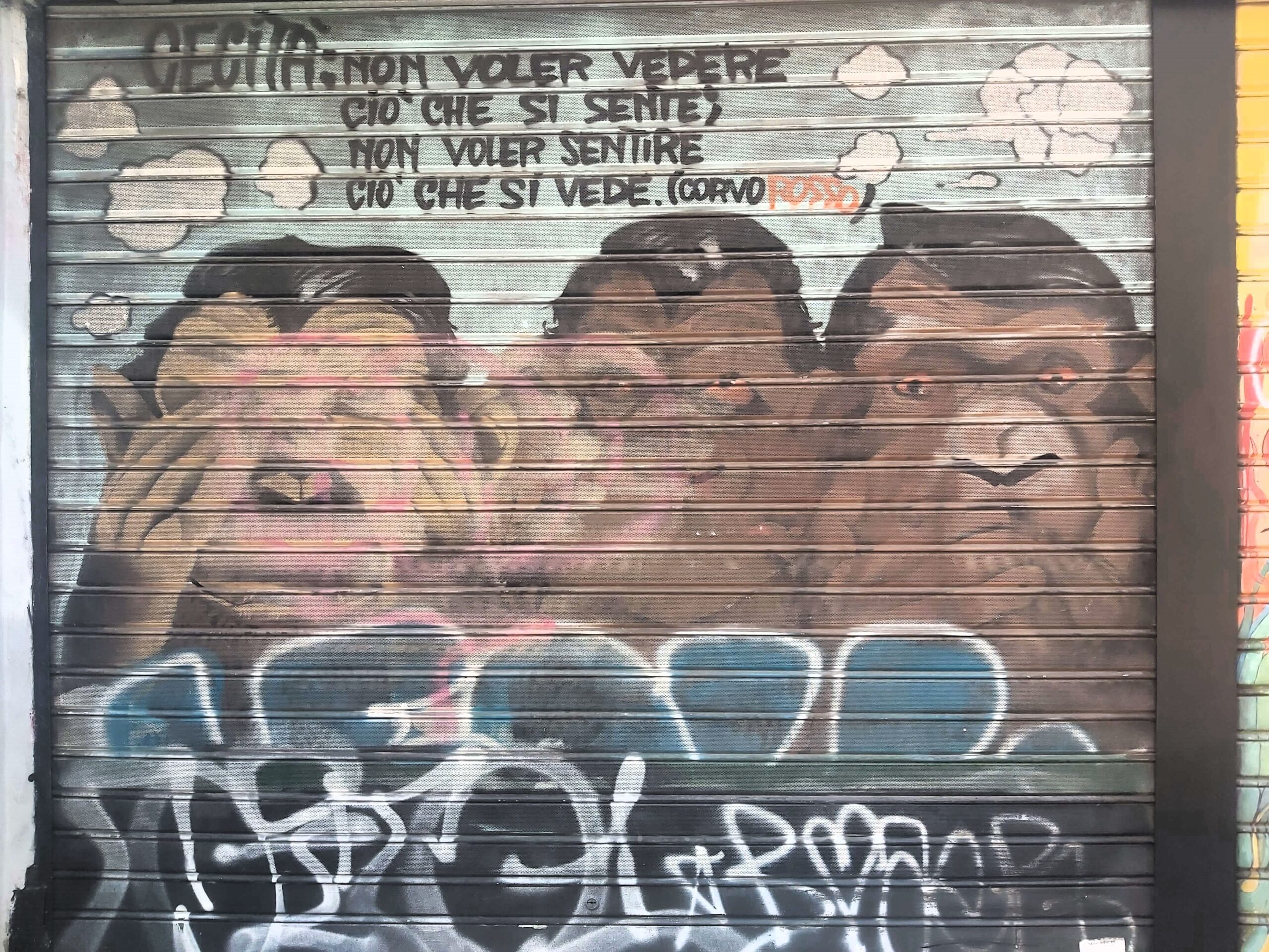 A graffiti image of three monkeys in Milan, Italy