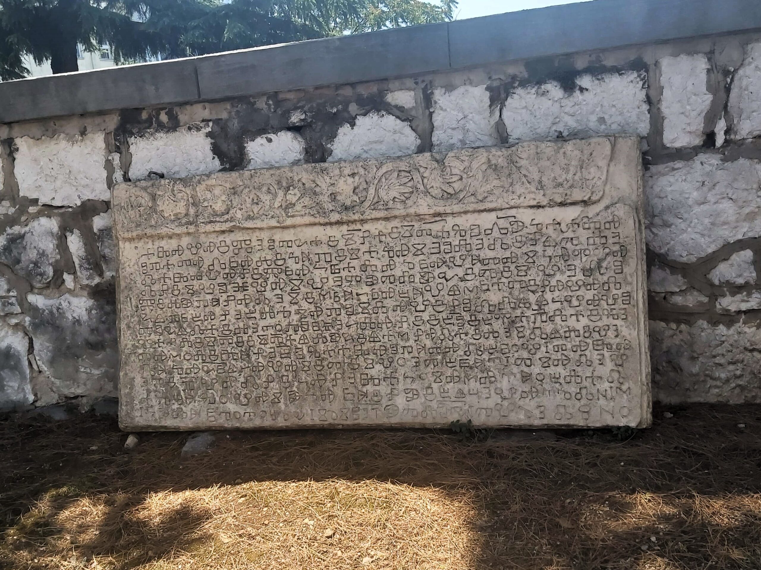 A large old stone tablet with strange, ancient writing on at Governor's Place, Rijeka, Croatia
