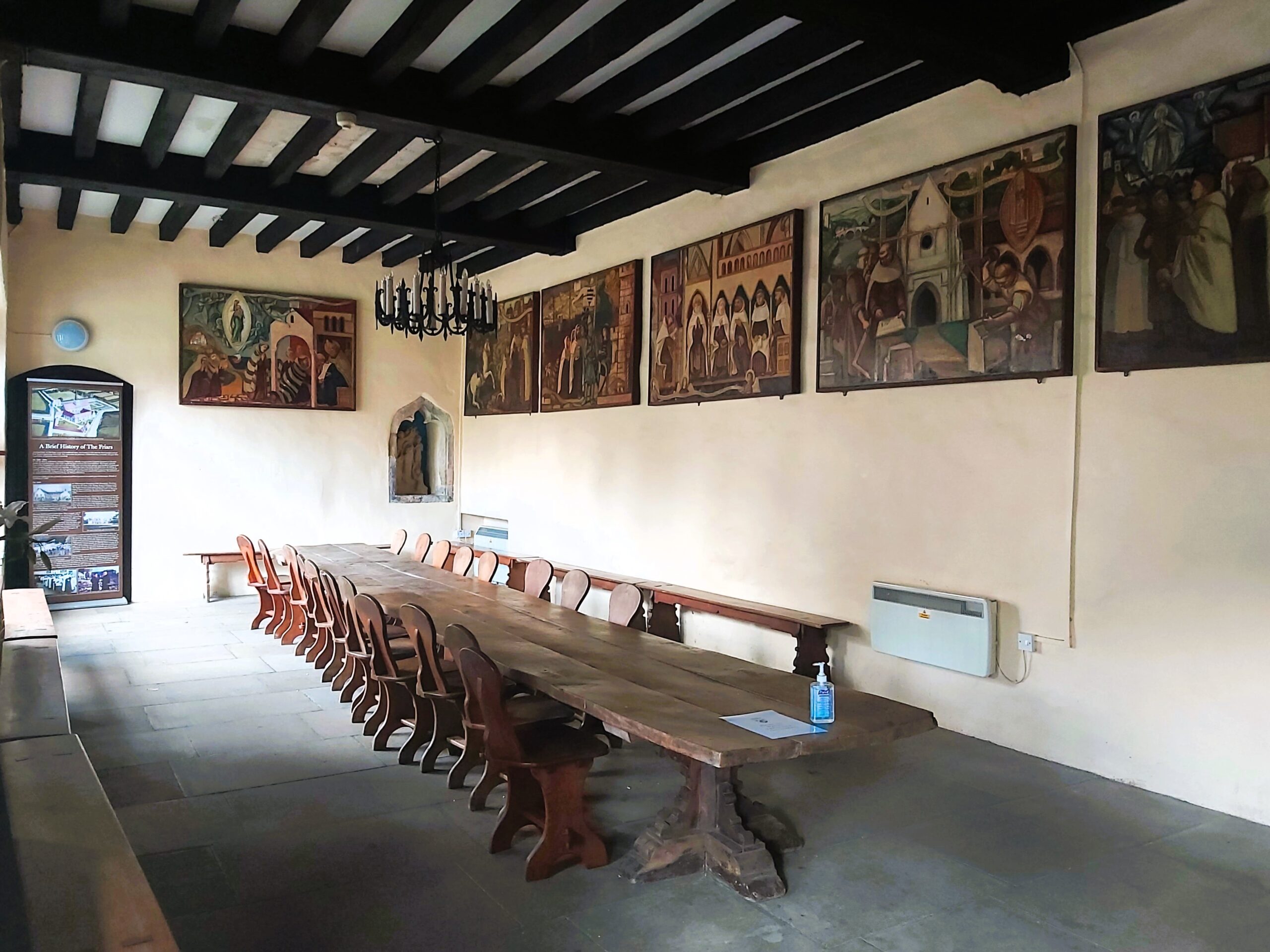 Long table and artwork in The Friars Aylesford Priory, Kent, England