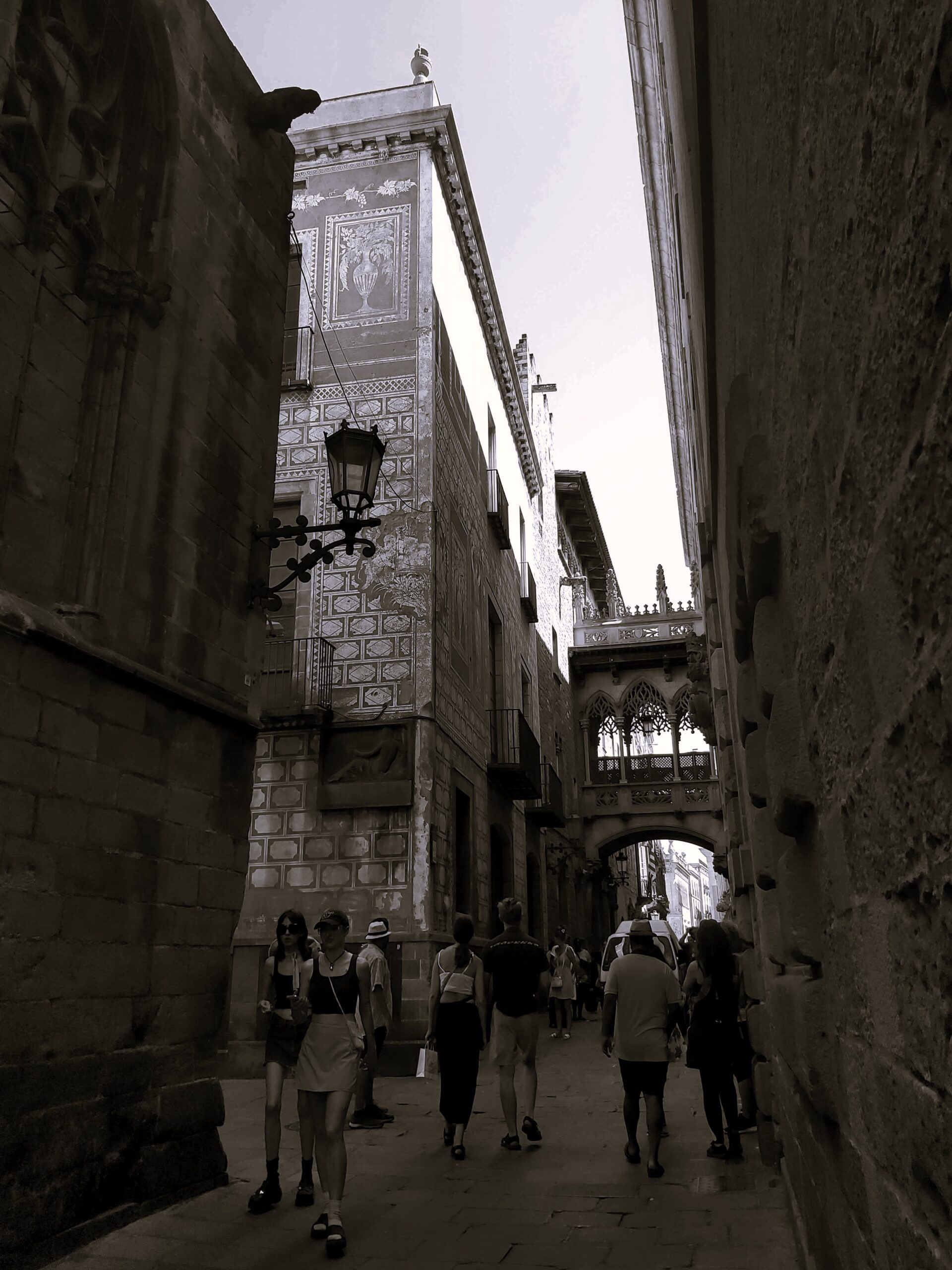 A black and white shot of an old street in Barcelona, Spain