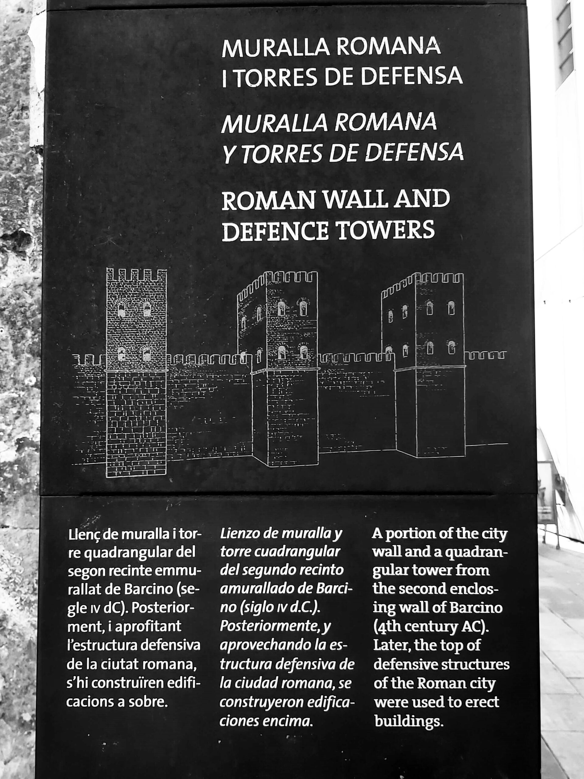 A sign about Roman wall and defence towers in Barcelona, Spain