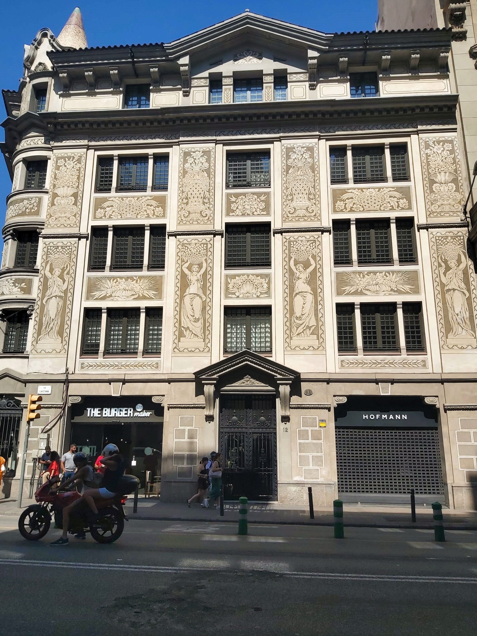 Building with frescoes on in Barcelona, Spain
