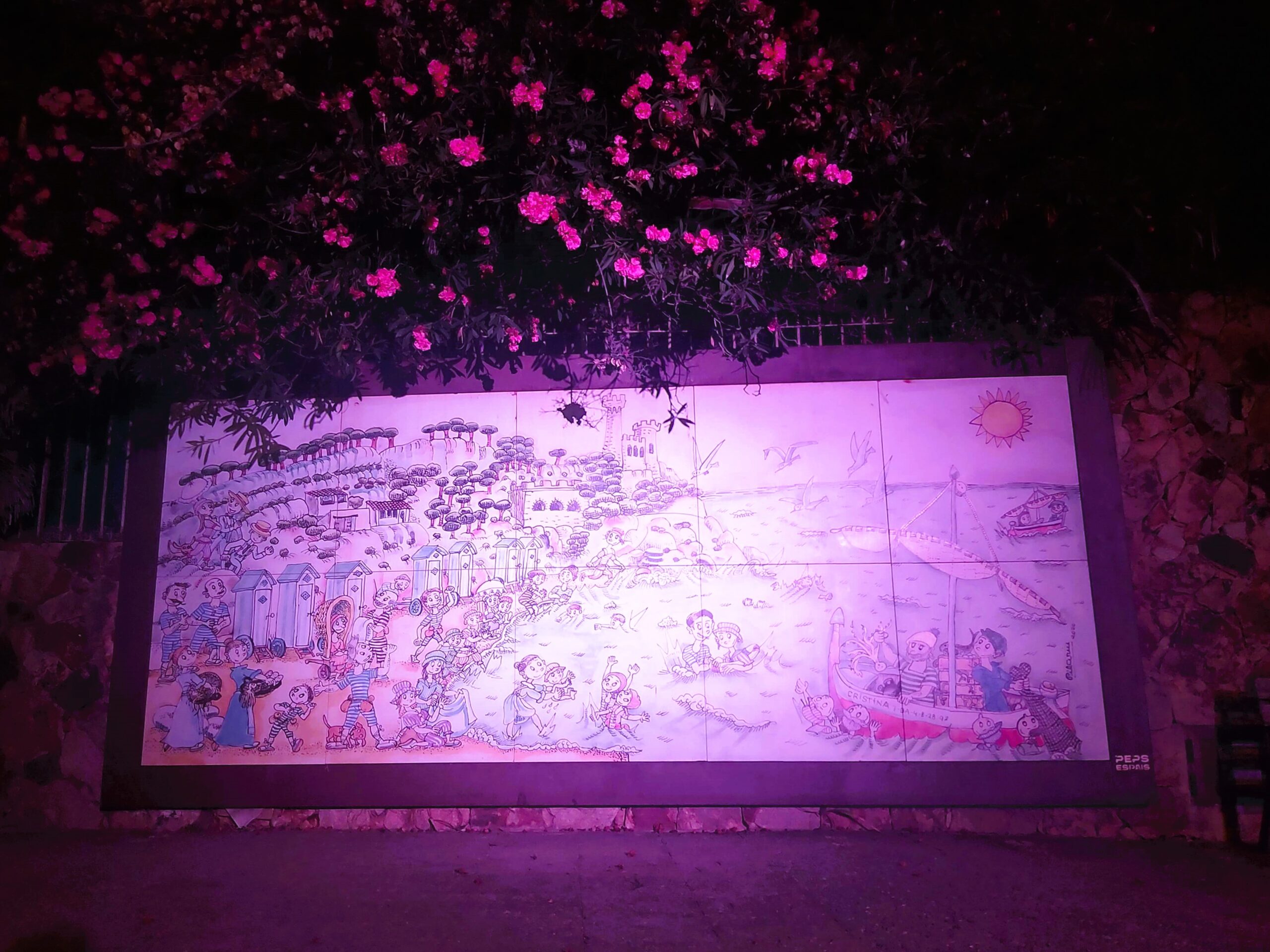 Tiled artwork at night in Lloret de Mar, Spain