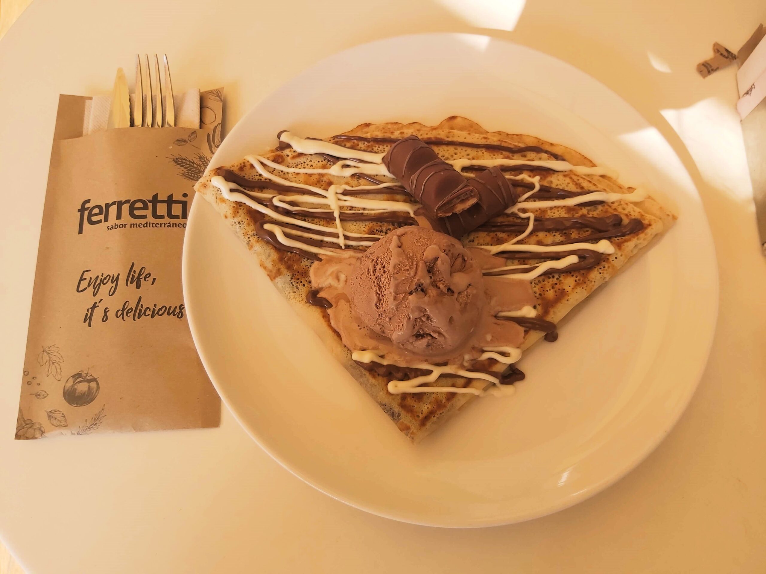 Delicious pancake with Kinder Bueno pieces and chocolate ice cream on top. Ferretti restaurant in Lloret de Mar, Spain.