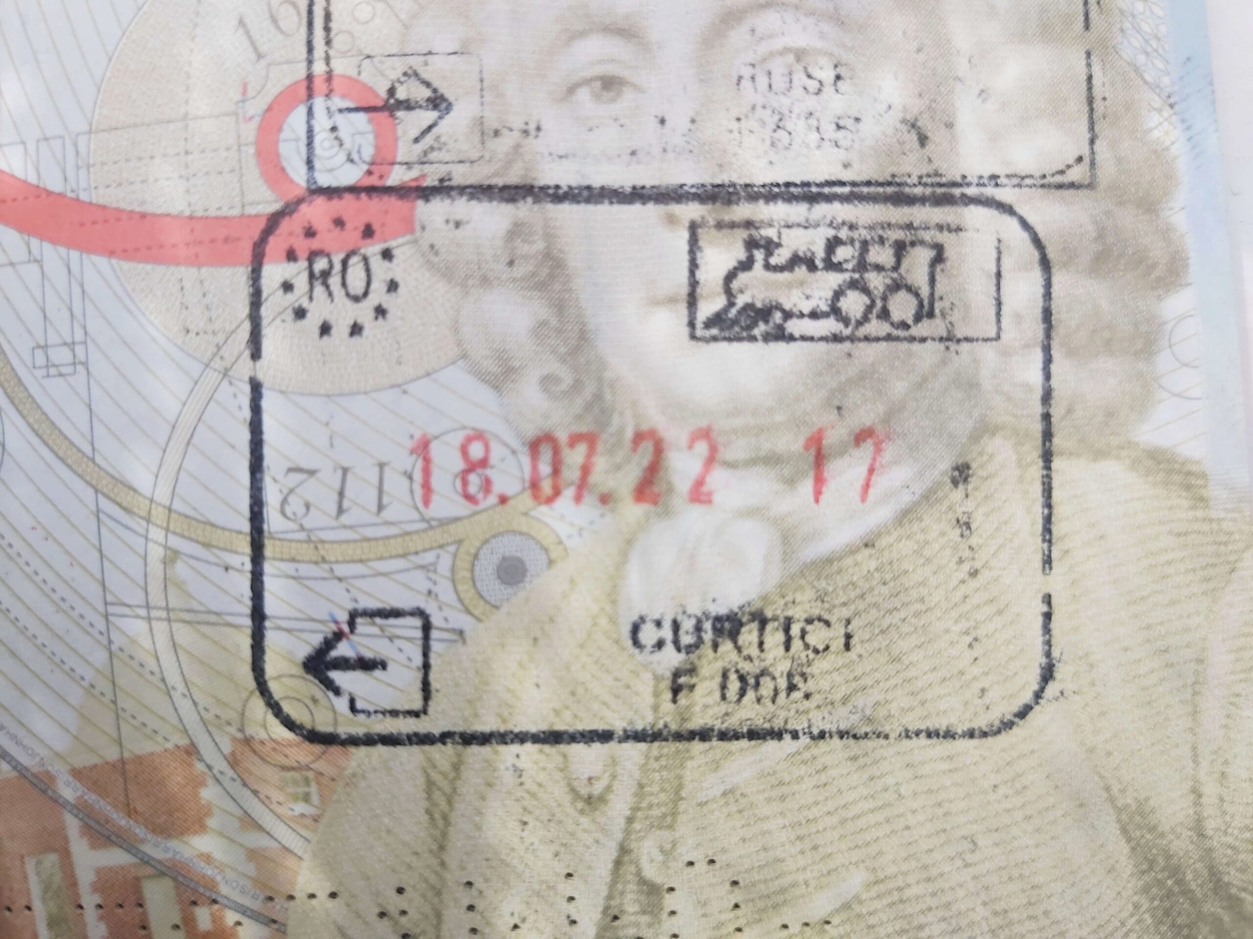 Close up of passport stamp with train symbol