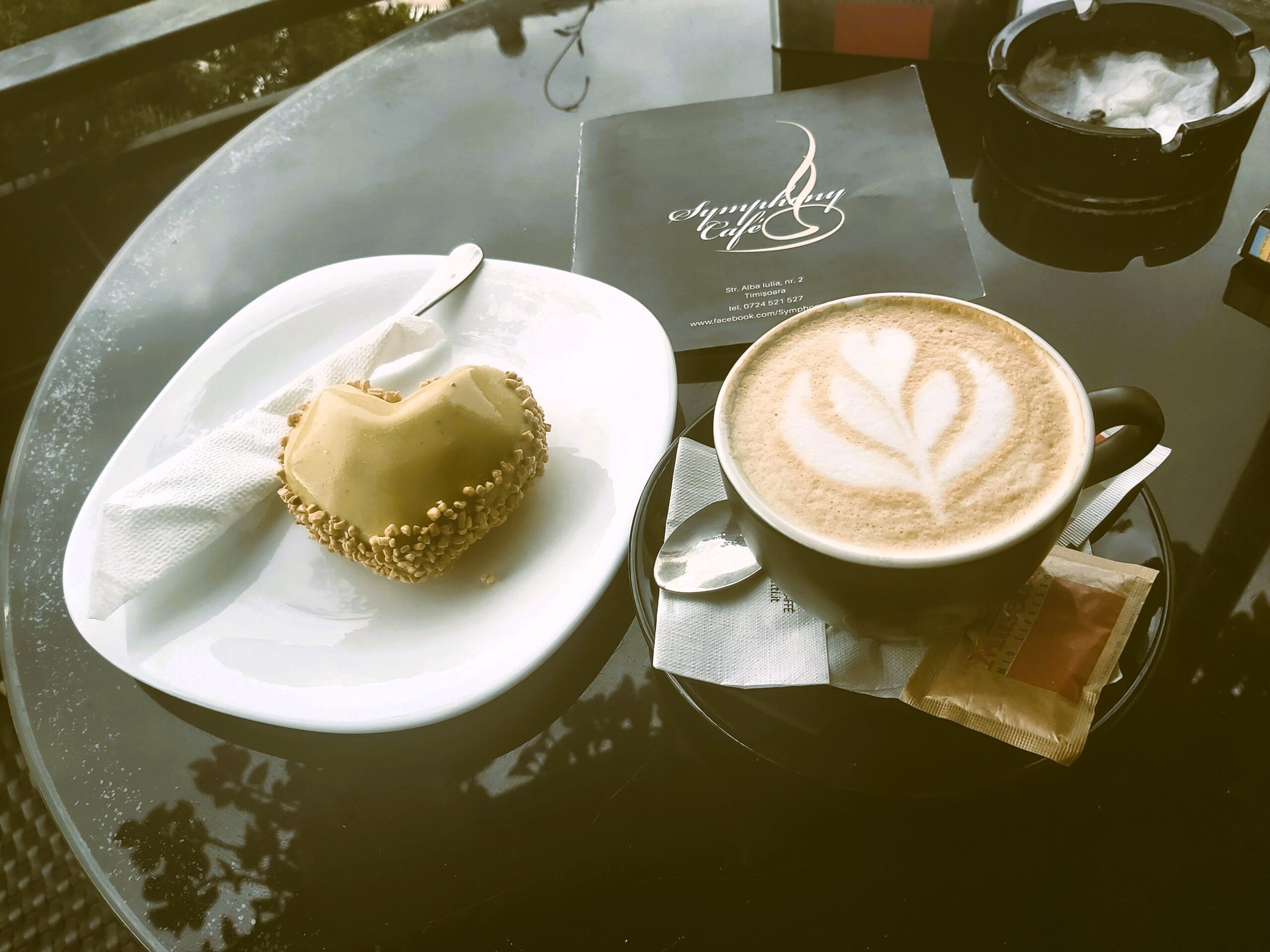 Pistachio dessert and coffee at Symphony Cafe in Timisoara, Romania.