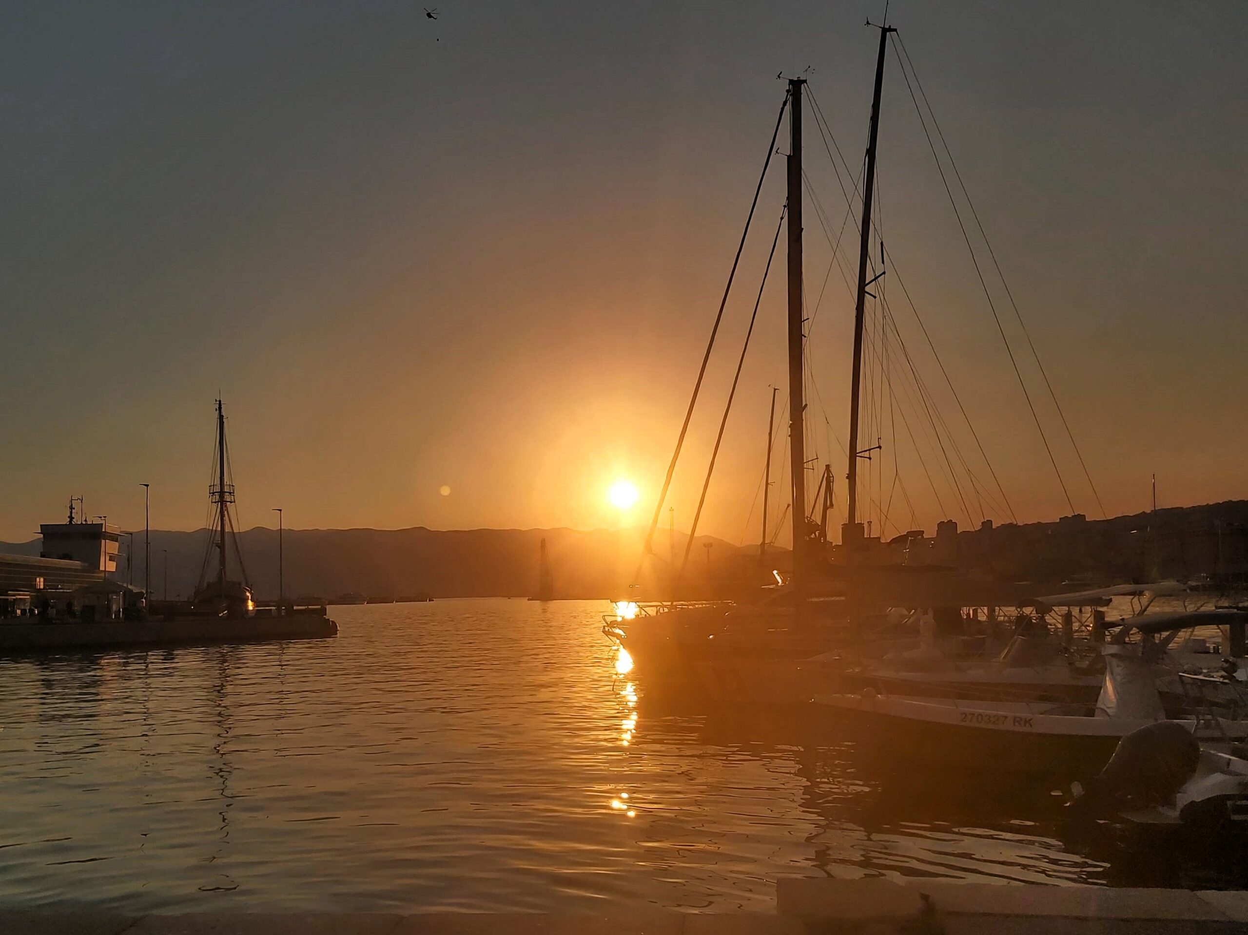 Sunset view of the harbour with boats, Rijeka, Croatia