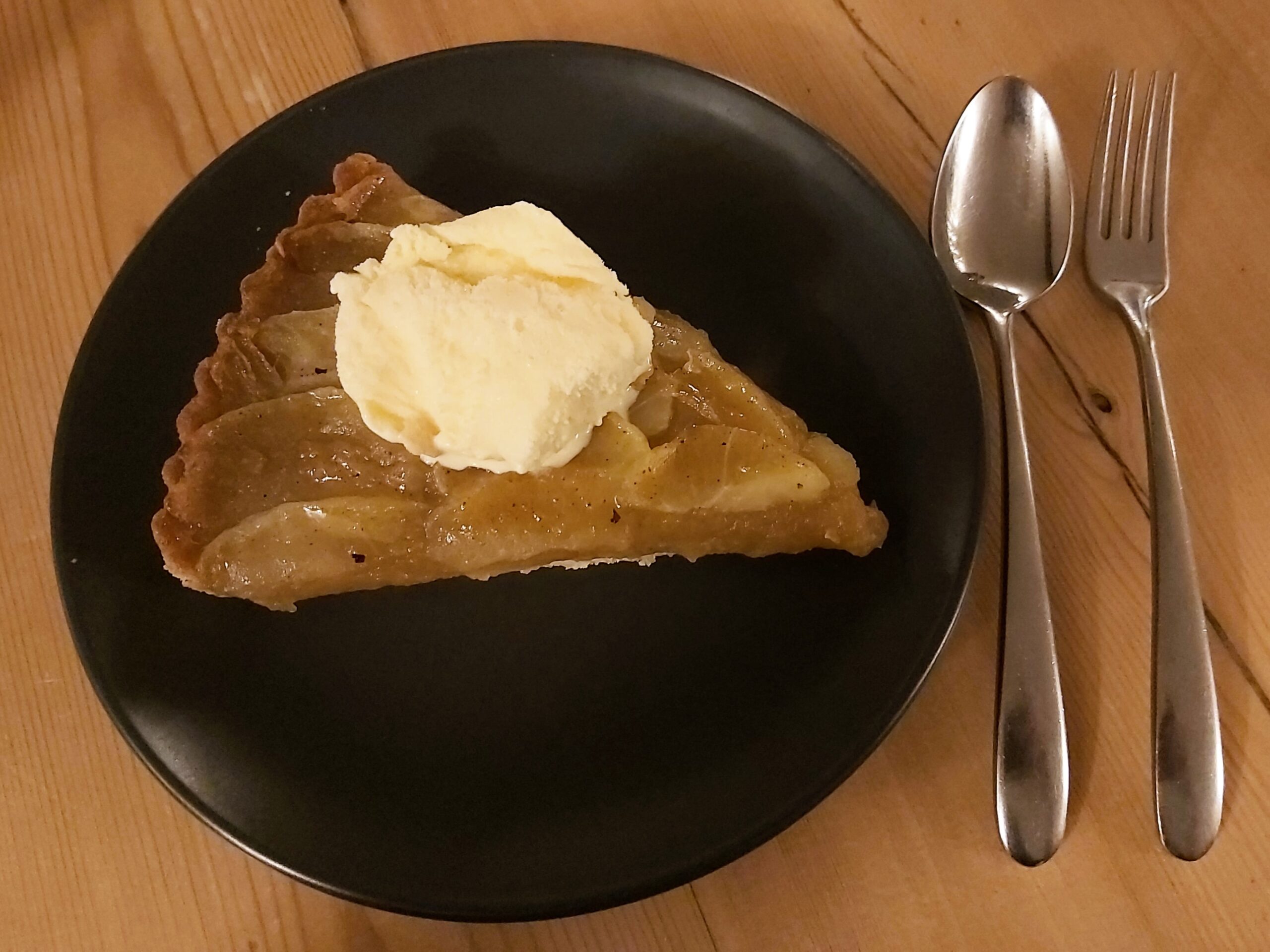 A freshly made fruit pie with ice cream from the Boot Inn, in Houghton, Hampshire, England