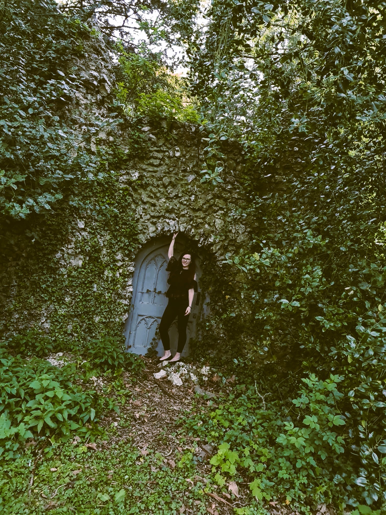 A fairy door with Wandering Lewis posing in front of it. Somewhere in Hampshire, England