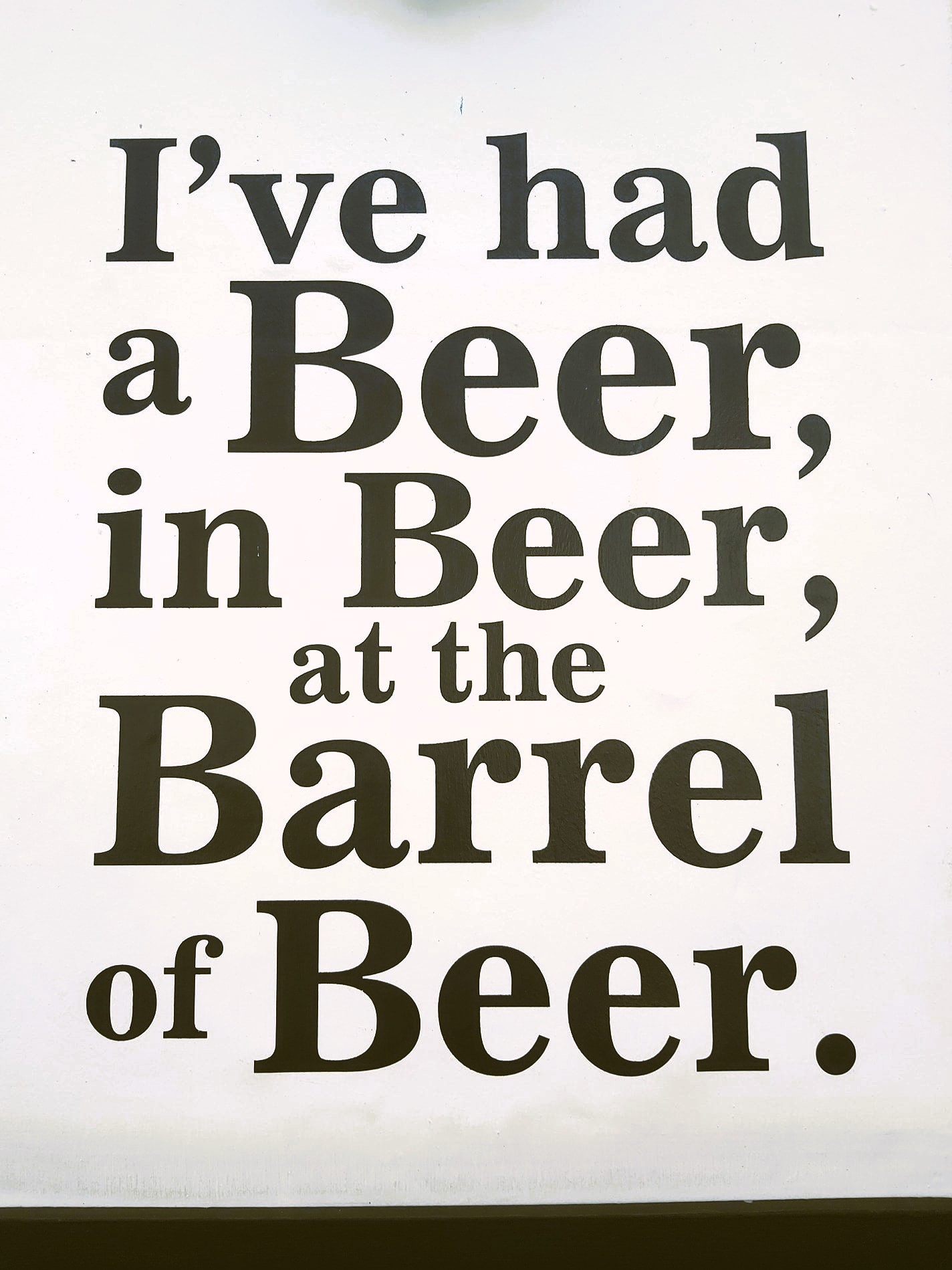 A sign reading "I've had a beer, in Beer, at the Barrel of Beer" in Beer, Devon, England.