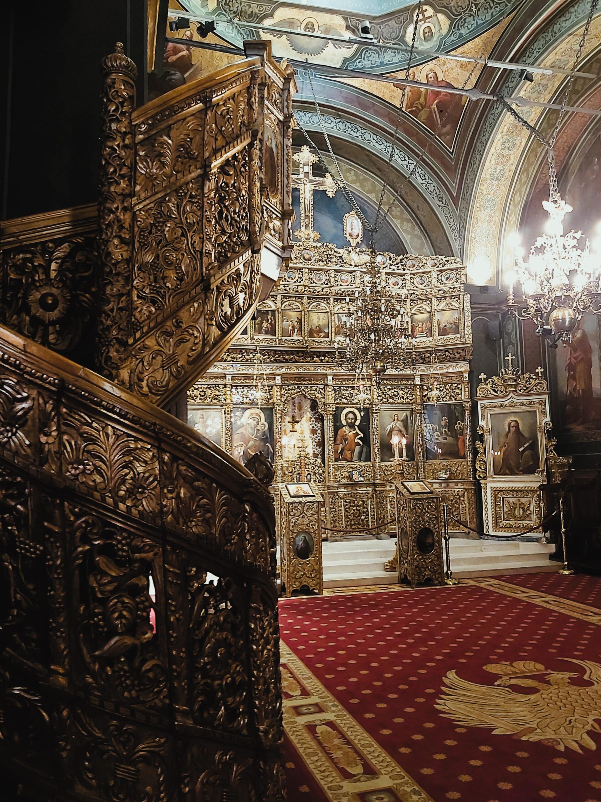 Wooden stairs and golden iconostasis in Biserica Albă in București, Romania