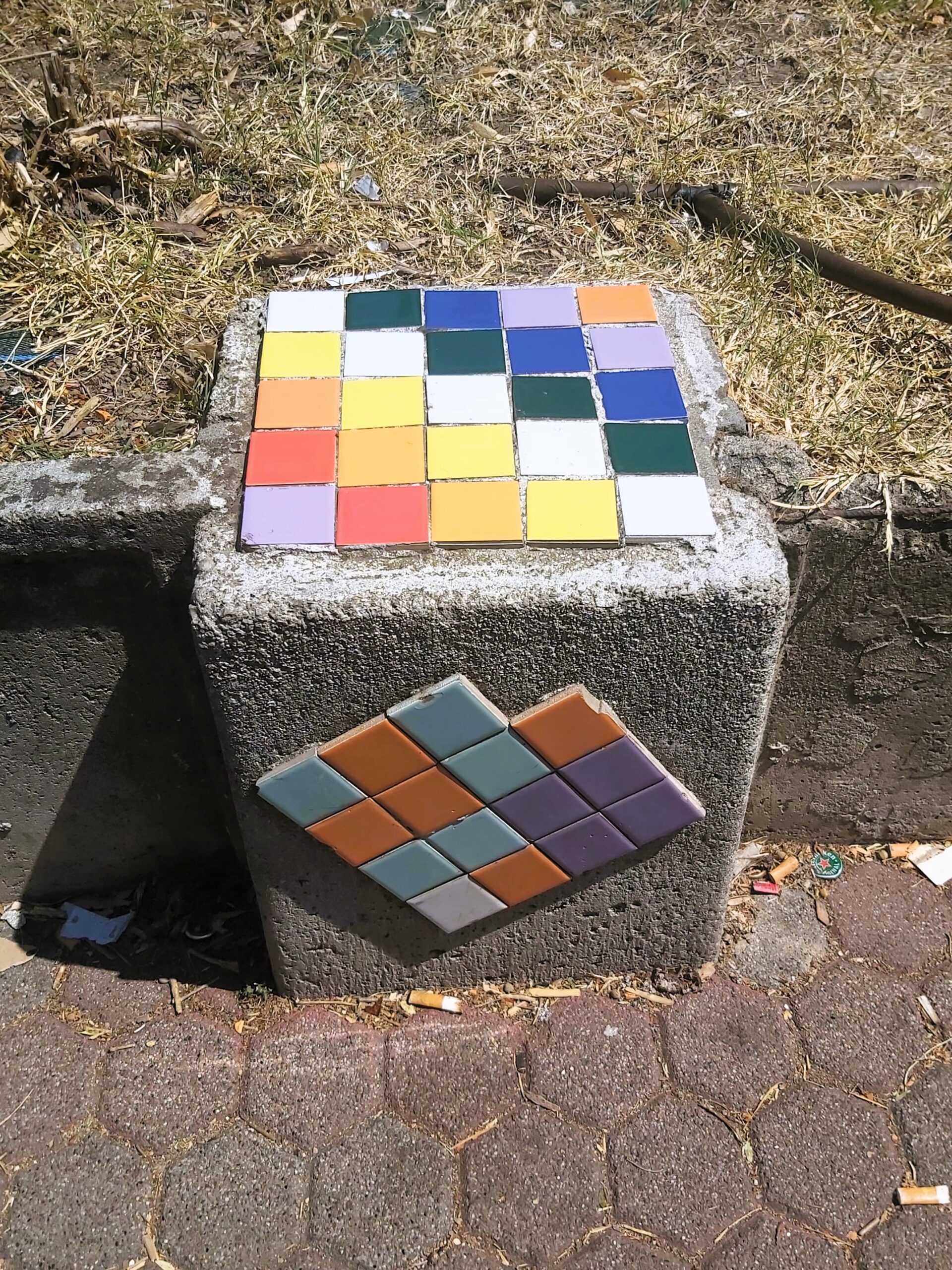 A random modern mosaic found on a concrete block in Mestre, Italy.