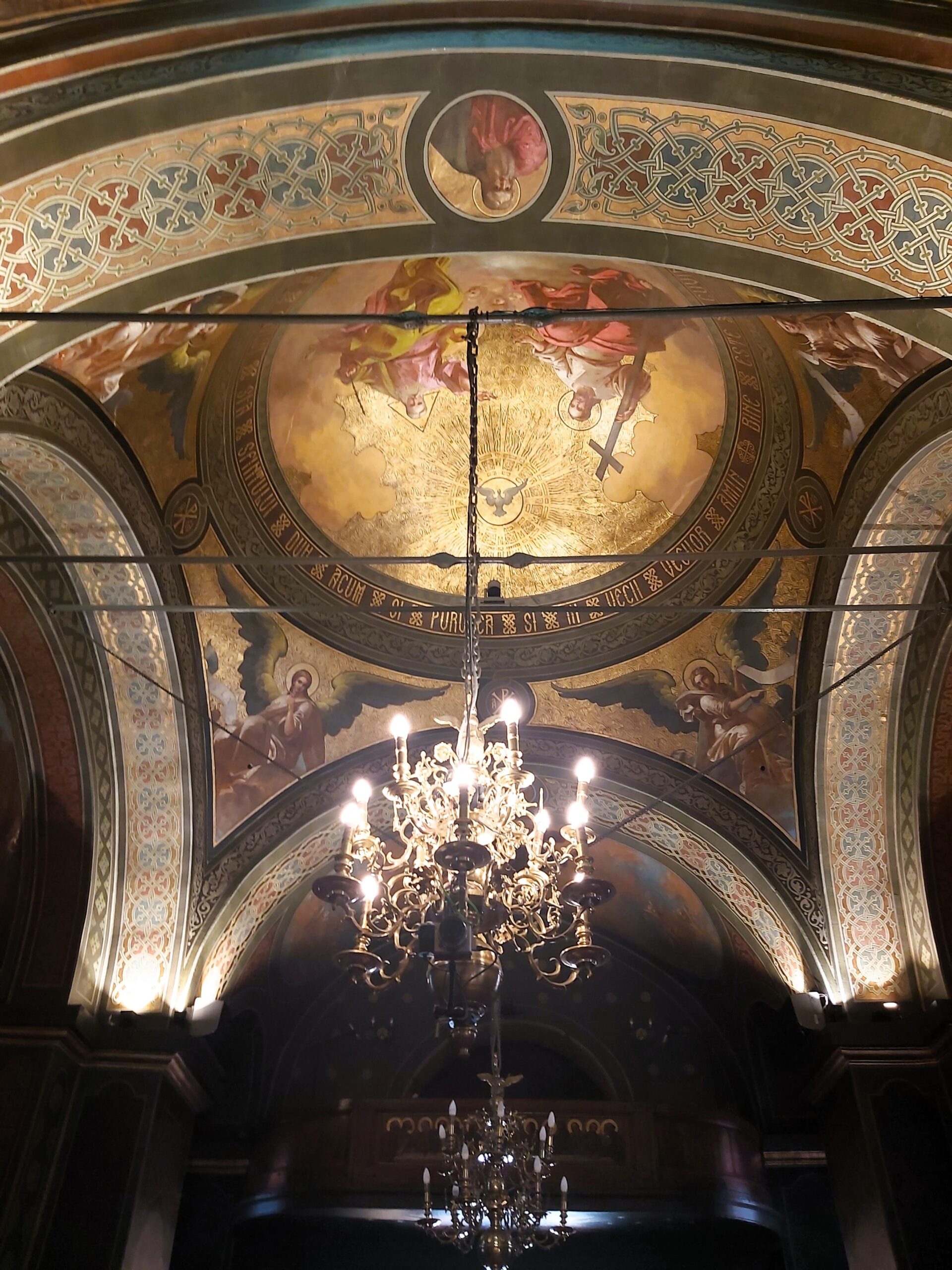 The golden ceiling and chandelier in Biserica Albă in București, Romania