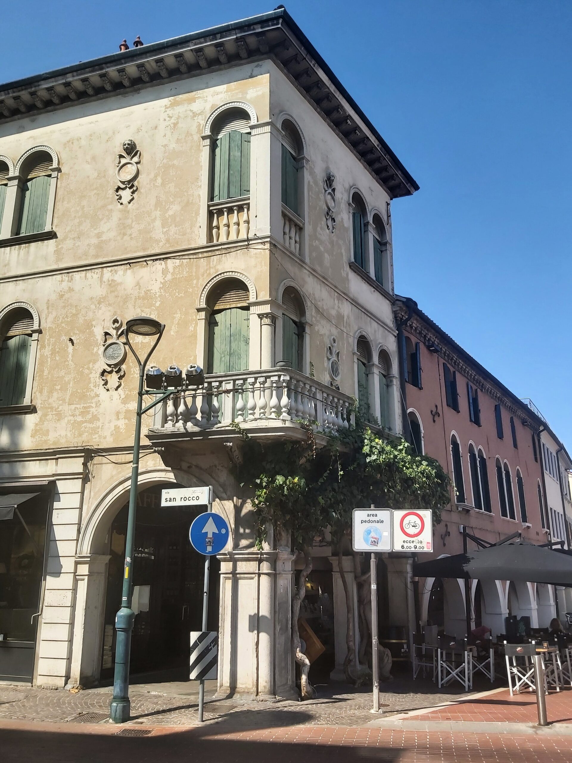 Pretty buildings with a balcony on the corner in Mestre, Italy