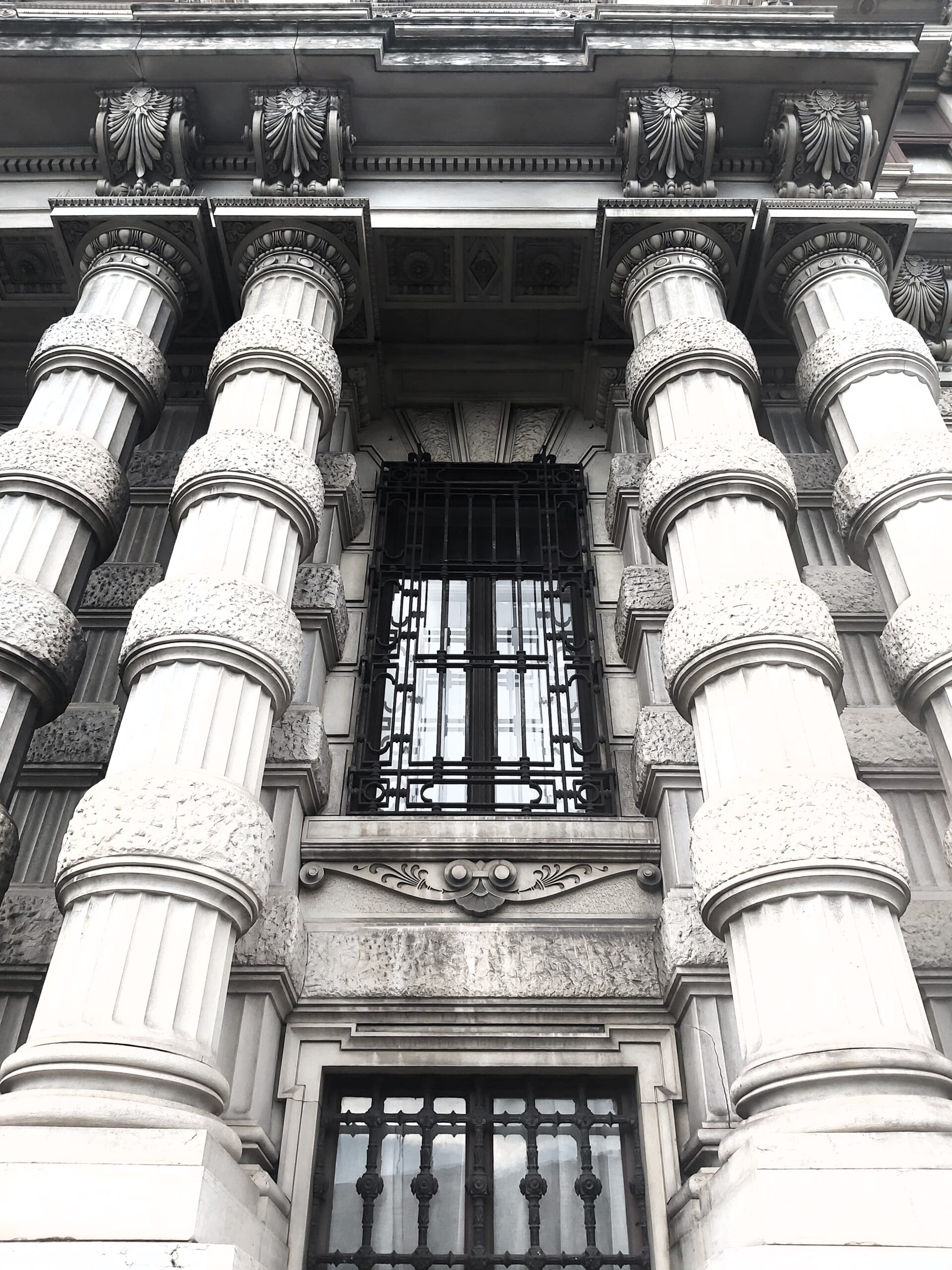 Columns and windows of a building in Trieste, Italy