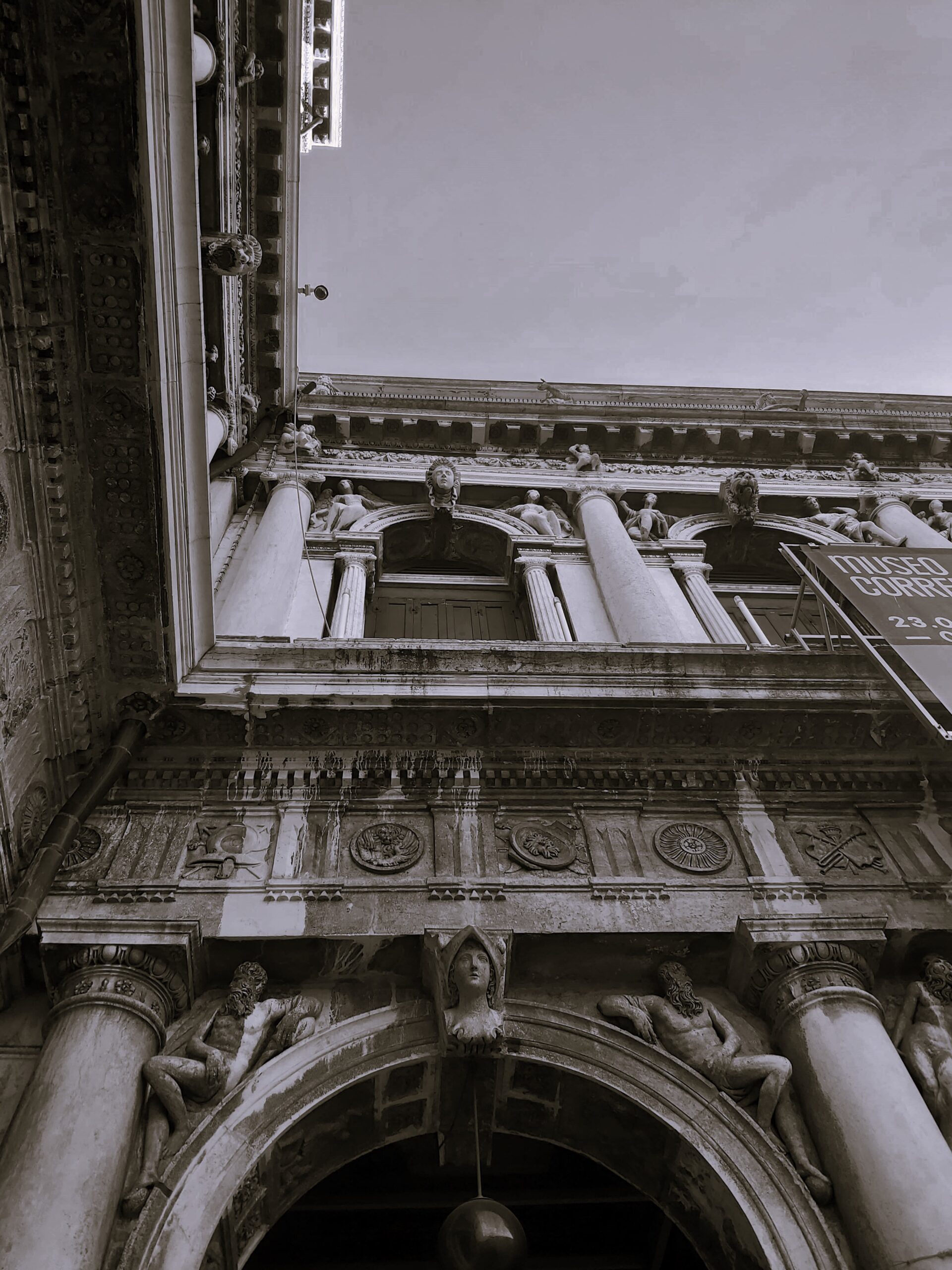 A black and white shot of some detailing on a building in Venice, Italy