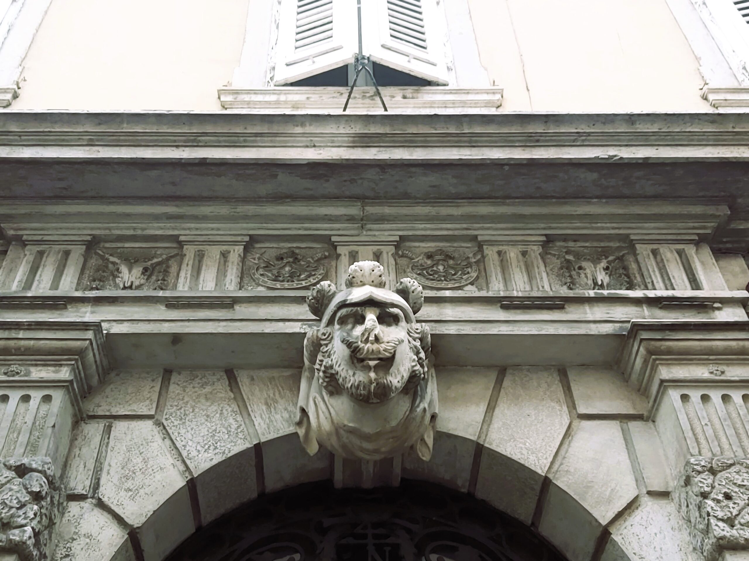 A grotesque above a door in Trieste, Italy