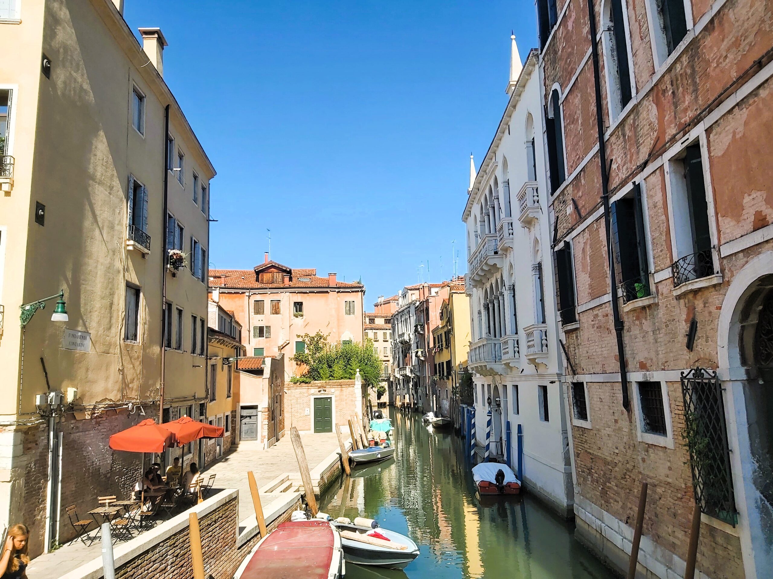 A colourful canal scene in summer in Venice, Italy