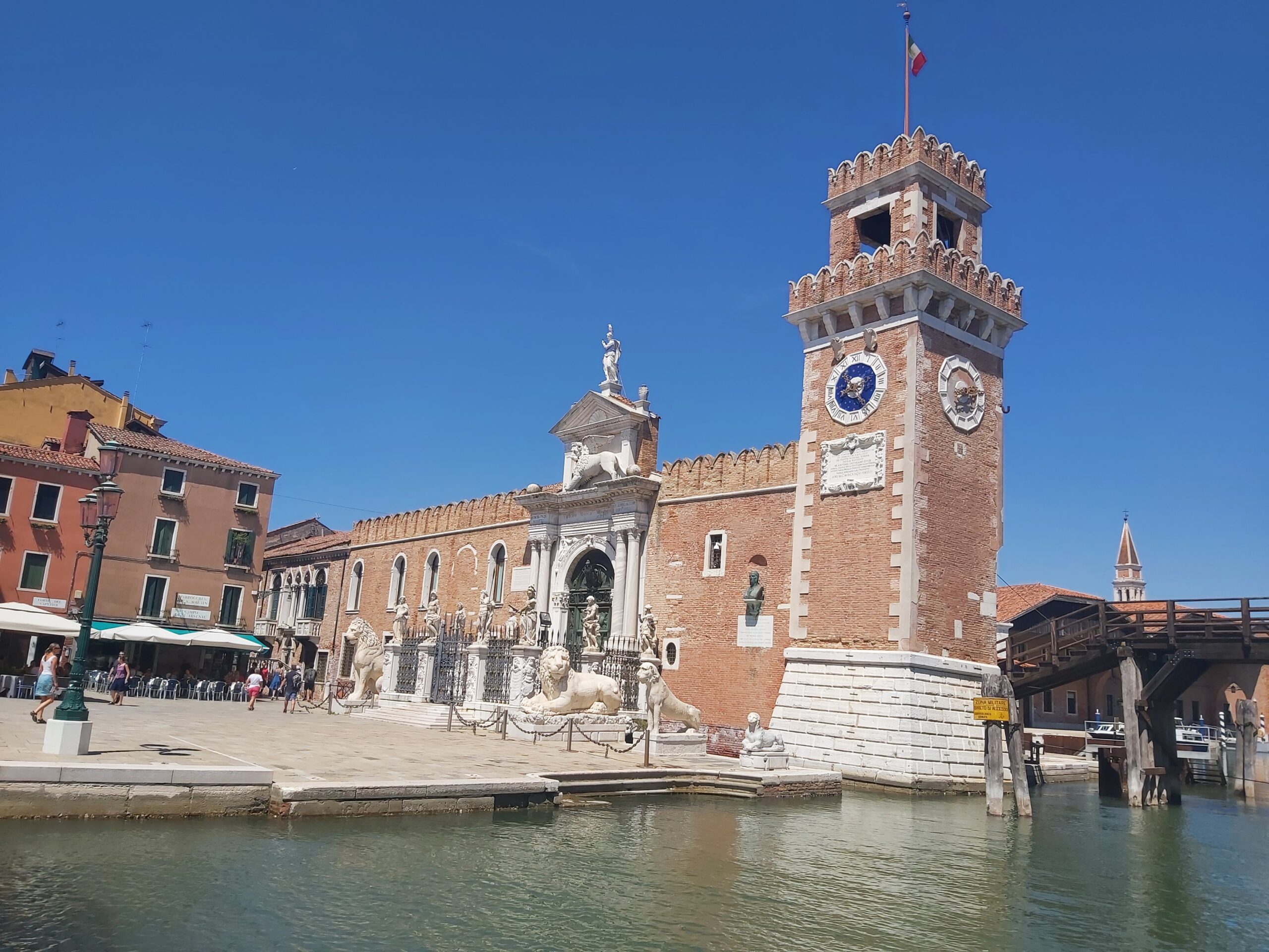 The entrance to The Venetian Arsenal and its statues of lions in Venice, Italy