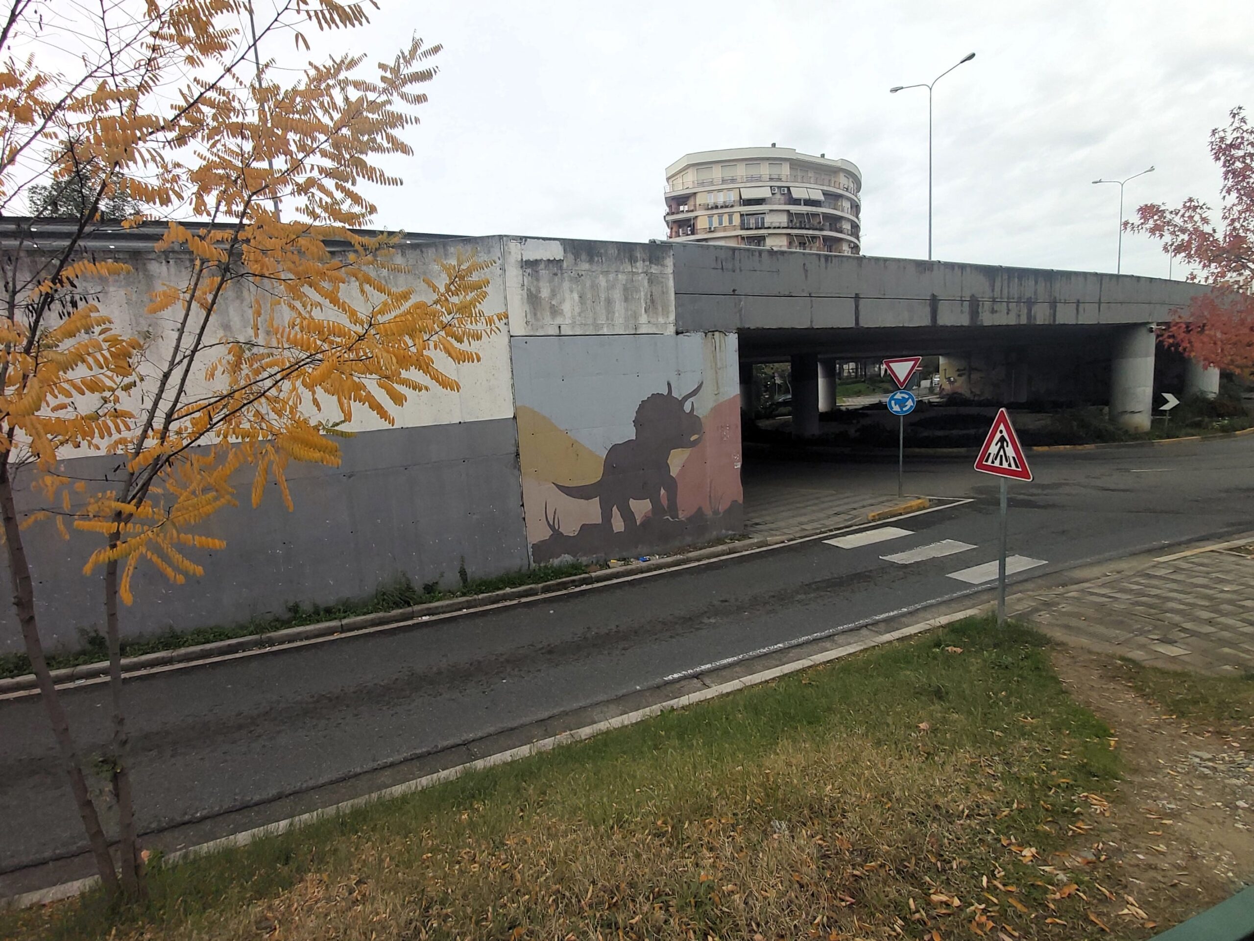 A triceratops mural by an underpass in Tirana, Albania