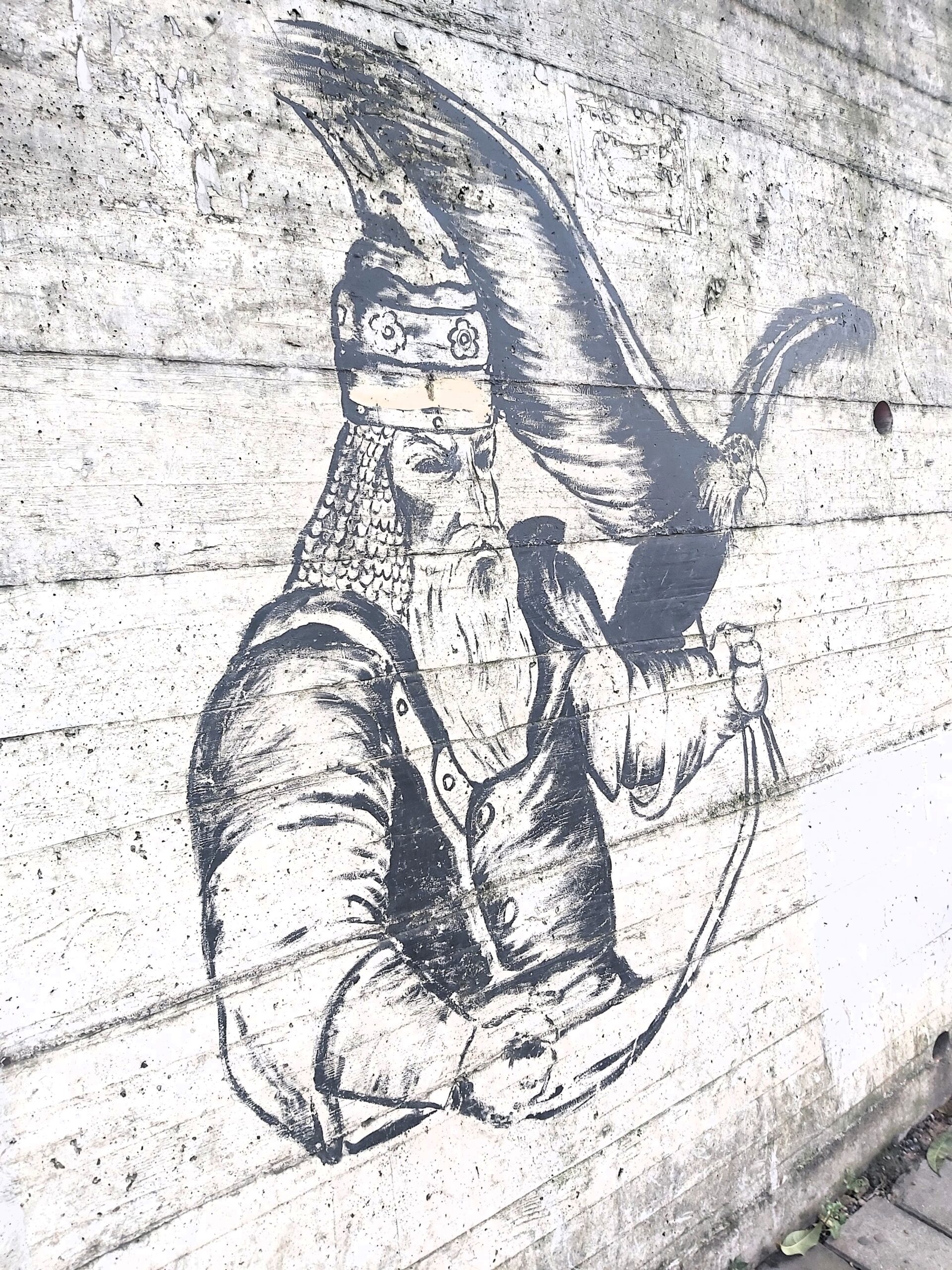 A mural (of Skanderberg?) with a bird of prey in Tirana, Albania
