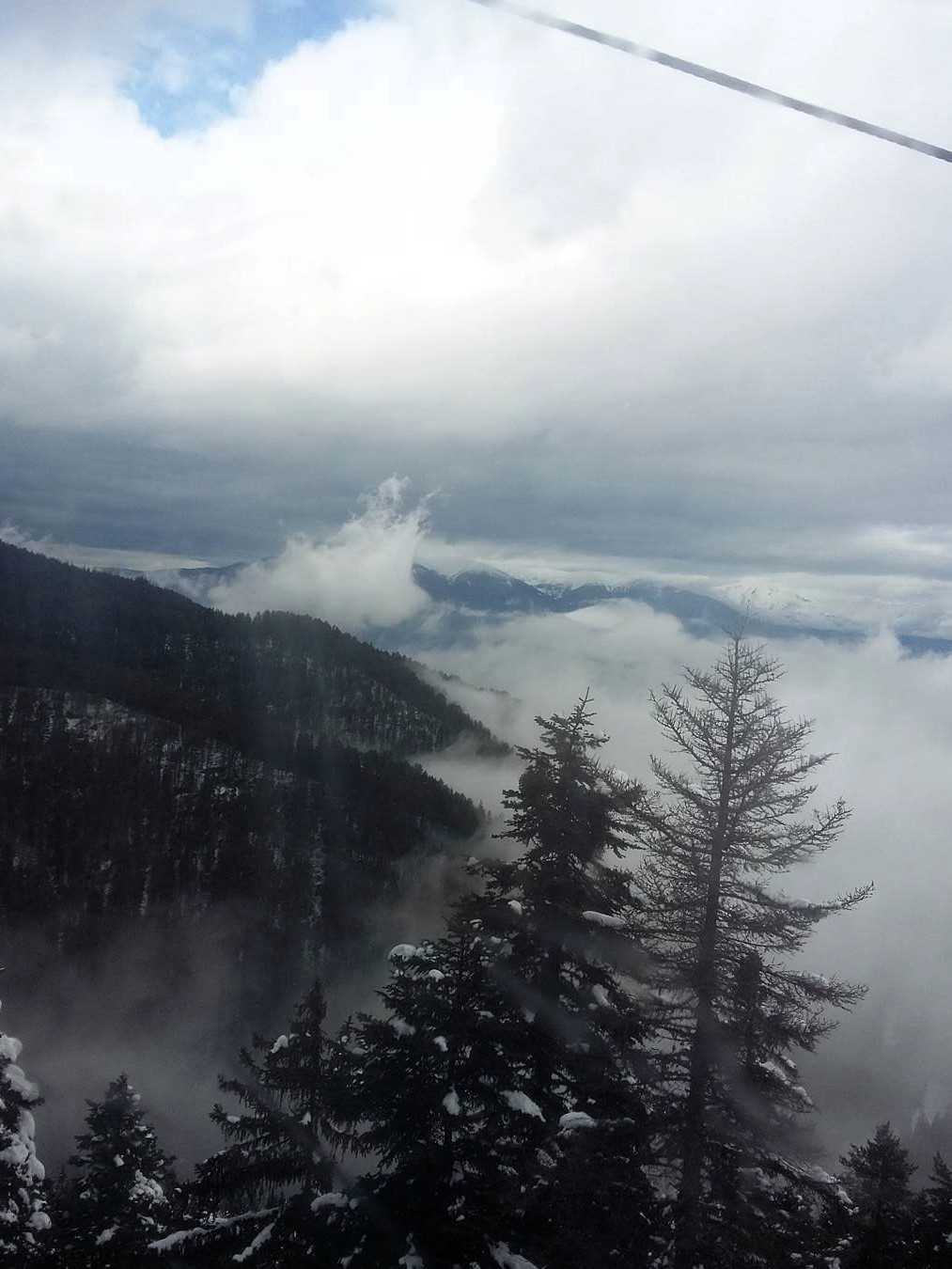 An eerie mist rises from the mountains in Bansko, Bulgaria