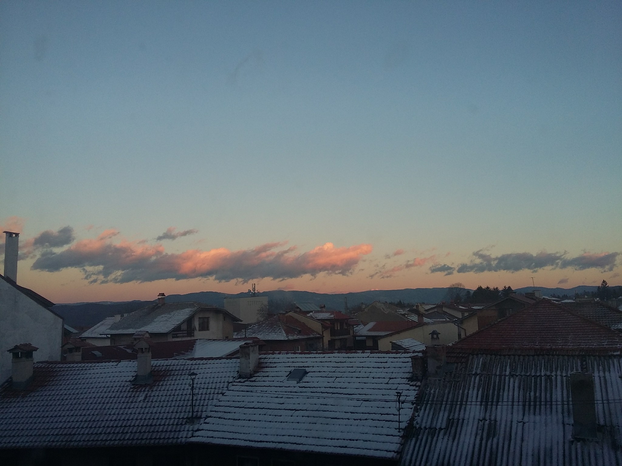 A pink sky above rooftops, Bansko, Bulgaria