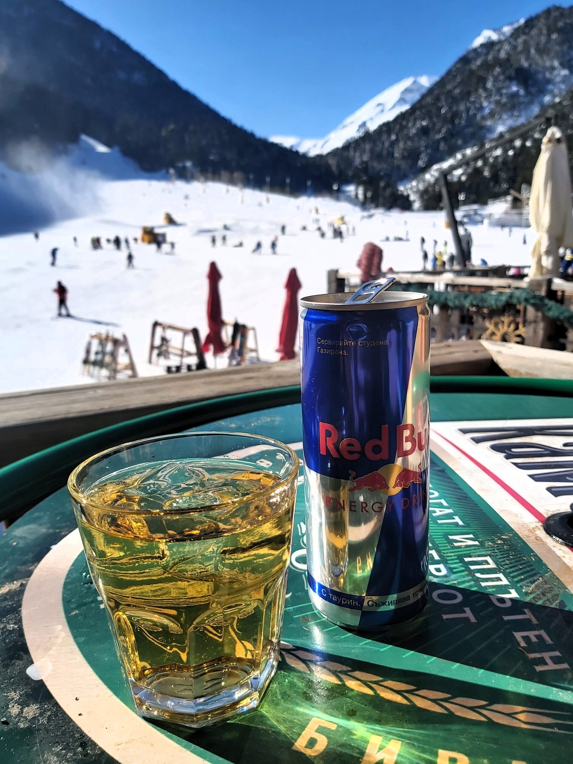 Vodka and redbull with a view of the slopes behind in Bansko, Bulgaria