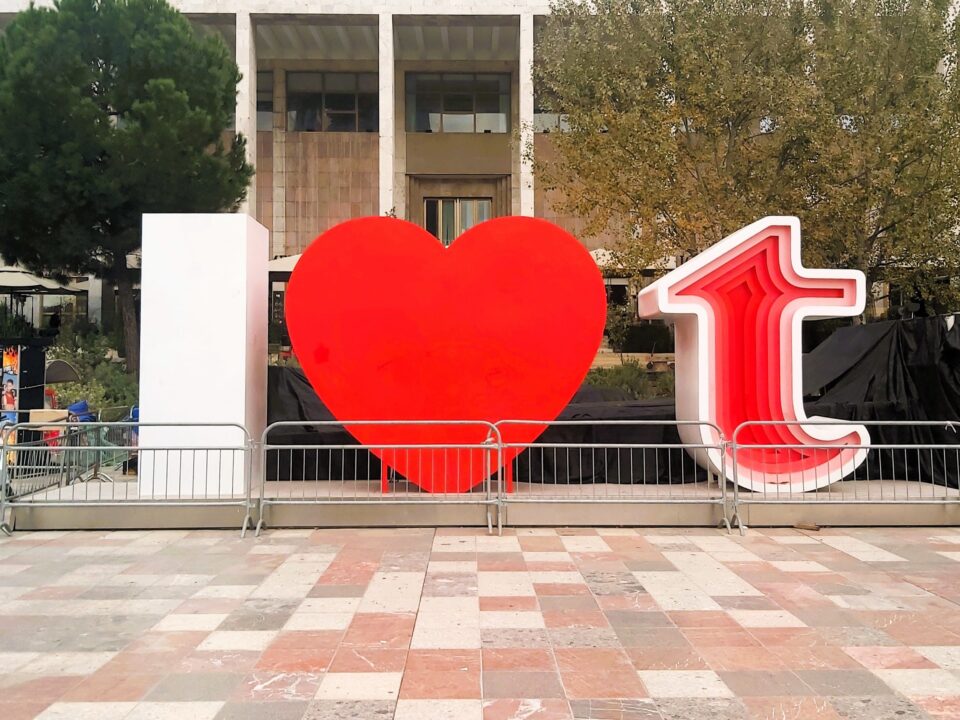 A modern art piece showing "I love Tirana" with a large red heart, situated in the main square. Albania.