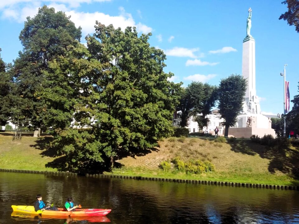 An orange canoe on a river in Riga, Latvia